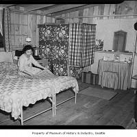 Internee Yoshi Hosokawa in her Camp Harmony barracks living area, Puyallup, 1942