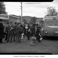 Internees arriving on buses at Camp Harmony, Puyallup, 1942